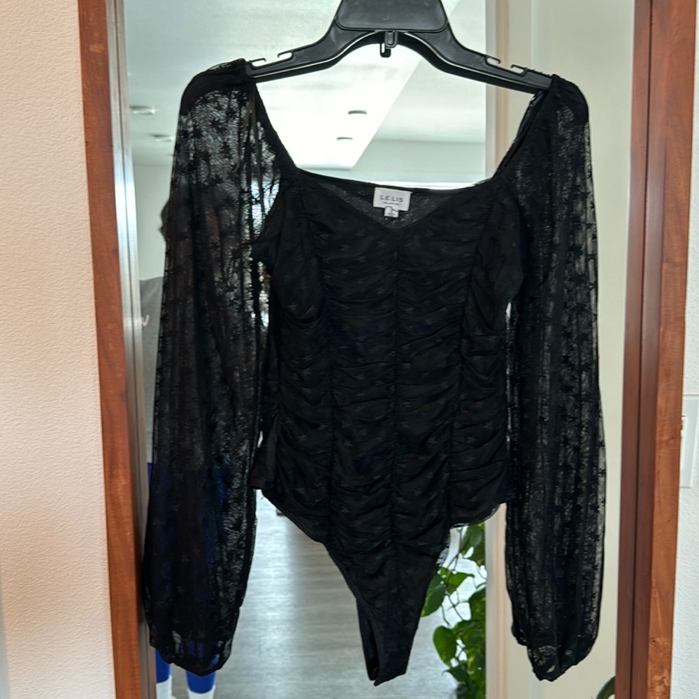 Le Lis black starred body suit with sheer sleeves